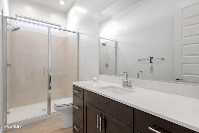 3885 E Kenley Ln, San Tan Valley, AZ 85143 - bathroom featuring toilet, a marble finish shower, wood finished floors, and vanity