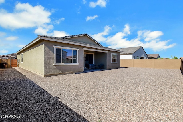 3885 E Kenley Ln, San Tan Valley, AZ 85143 - back of property with stucco siding, a fenced backyard, and a patio area