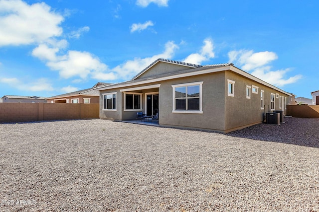 3885 E Kenley Ln, San Tan Valley, AZ 85143 - rear view of house with a fenced backyard, stucco siding, a patio, and central AC