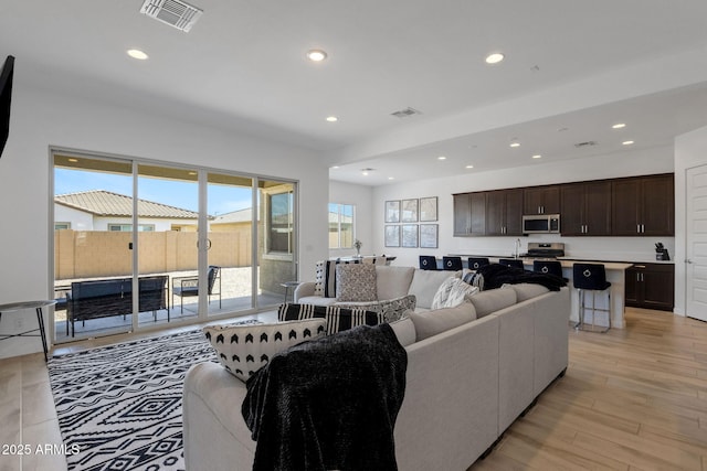 3885 E Kenley Ln, San Tan Valley, AZ 85143 - living room with recessed lighting and light wood-style floors