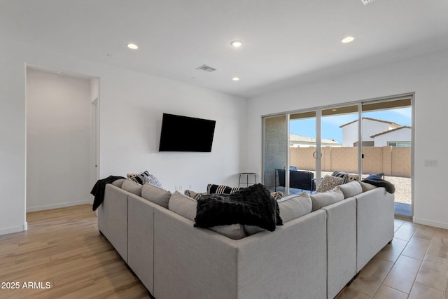 3885 E Kenley Ln, San Tan Valley, AZ 85143 - living room with recessed lighting, baseboards, and light wood-type flooring