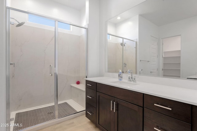 3885 E Kenley Ln, San Tan Valley, AZ 85143 - full bathroom with a marble finish shower, vanity, and wood finished floors