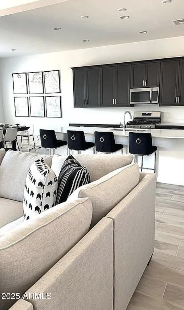 3885 E Kenley Ln, San Tan Valley, AZ 85143 - living area featuring recessed lighting and light wood-type flooring
