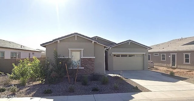 3885 E Kenley Ln, San Tan Valley, AZ 85143 - view of front of house with driveway, a garage, stucco siding, stone siding, and fence