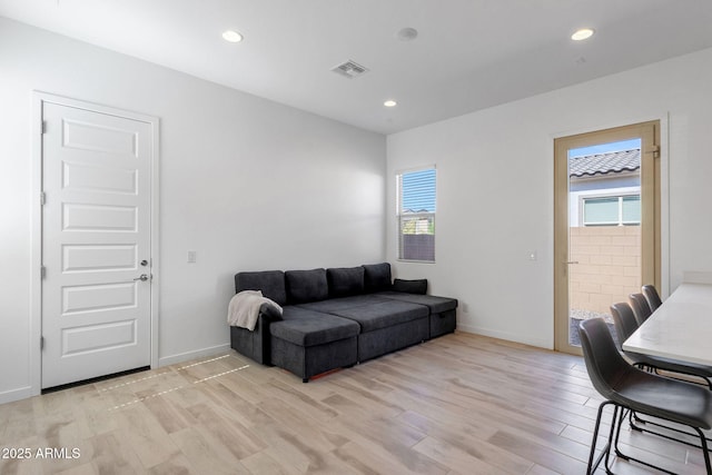 3885 E Kenley Ln, San Tan Valley, AZ 85143 - living room featuring light wood-style flooring, baseboards, and recessed lighting