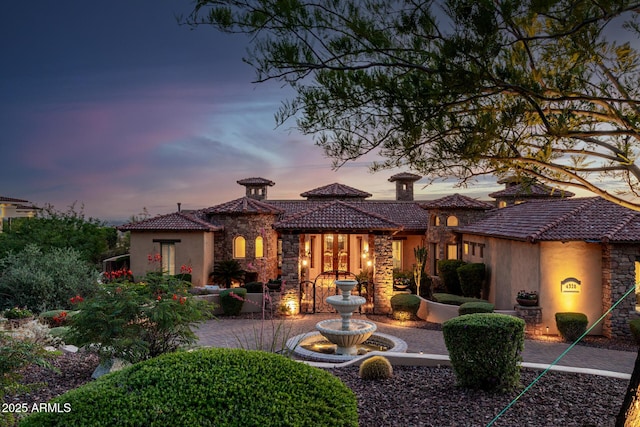 4328 N Pinnacle Ridge Cir, Mesa, AZ 85207 - back of house with stone siding, a tile roof, and stucco siding