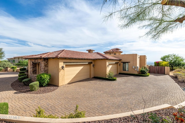 4328 N Pinnacle Ridge Cir, Mesa, AZ 85207 - view of front of home with stucco siding, an attached garage, decorative driveway, a tiled roof, and stone siding
