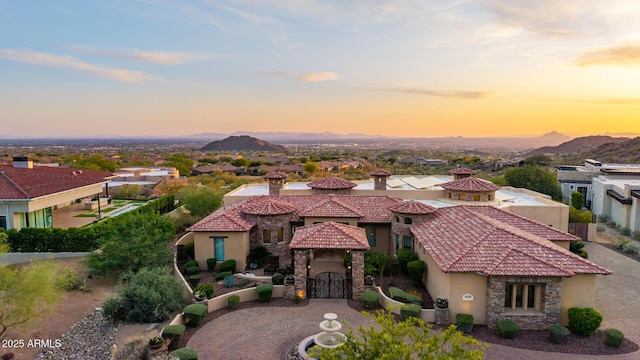 4328 N Pinnacle Ridge Cir, Mesa, AZ 85207 - mediterranean / spanish home featuring stucco siding, a tile roof, stone siding, and a mountain view