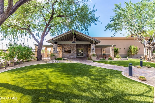 4328 N Pinnacle Ridge Cir, Mesa, AZ 85207 - craftsman house featuring french doors, stucco siding, a front lawn, stone siding, and a patio