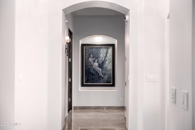 4328 N Pinnacle Ridge Cir, Mesa, AZ 85207 - hall with arched walkways, marble tiled floors, and baseboards