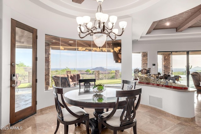 4328 N Pinnacle Ridge Cir, Mesa, AZ 85207 - dining space with a chandelier, a tray ceiling, healthy amount of natural light, and baseboards