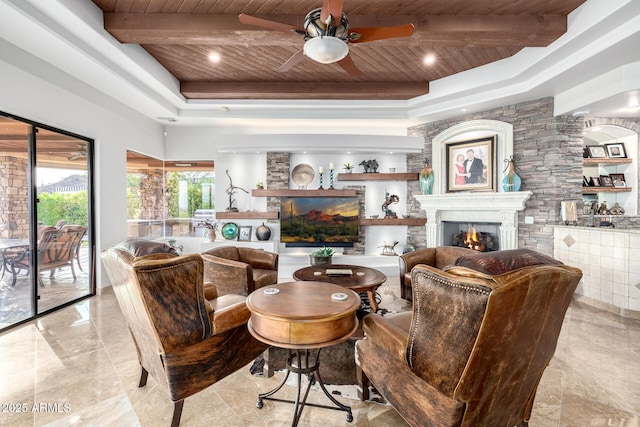 4328 N Pinnacle Ridge Cir, Mesa, AZ 85207 - sitting room featuring wooden ceiling with exposed beams, a ceiling fan, a warm lit fireplace, marble tiled floors, and a raised ceiling