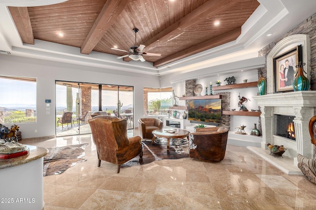 4328 N Pinnacle Ridge Cir, Mesa, AZ 85207 - living room with a high end fireplace, wooden ceiling, a raised ceiling, and a ceiling fan