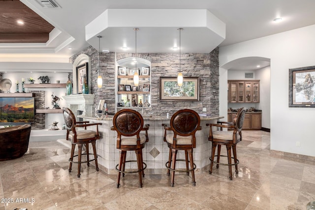 4328 N Pinnacle Ridge Cir, Mesa, AZ 85207 - indoor bar featuring baseboards, arched walkways, light marble finish floors, and a multi sided fireplace