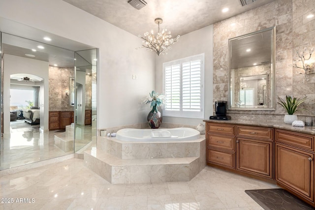 4328 N Pinnacle Ridge Cir, Mesa, AZ 85207 - ensuite bathroom featuring vanity, a garden tub, a chandelier, and marble tiled floors