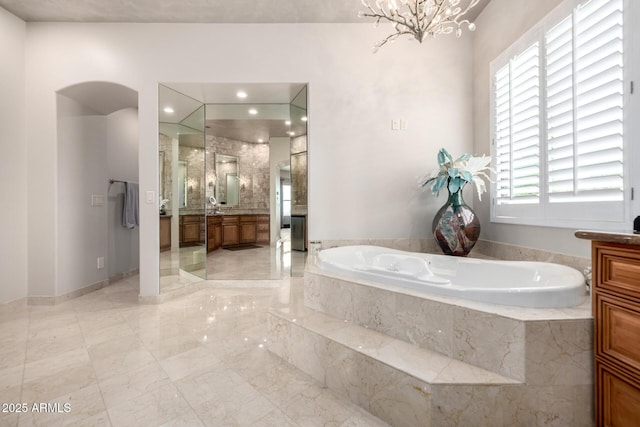 4328 N Pinnacle Ridge Cir, Mesa, AZ 85207 - bathroom featuring vanity, a garden tub, a chandelier, and marble tiled floors