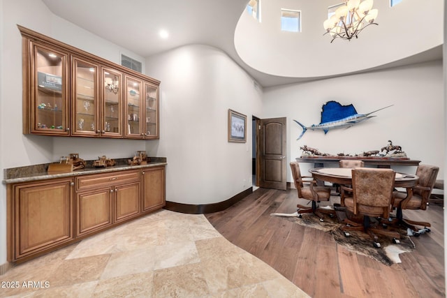 4328 N Pinnacle Ridge Cir, Mesa, AZ 85207 - dining space with a chandelier, wood finished floors, recessed lighting, and a towering ceiling