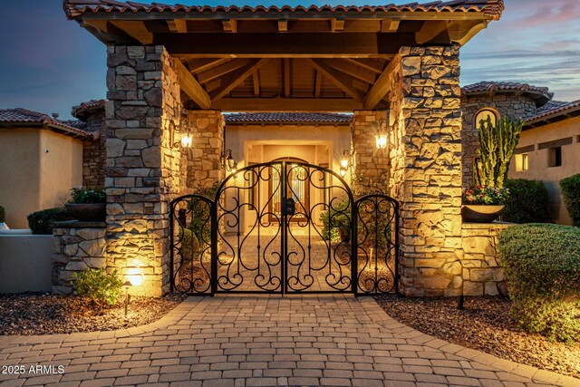 4328 N Pinnacle Ridge Cir, Mesa, AZ 85207 - gate at dusk with a fenced front yard
