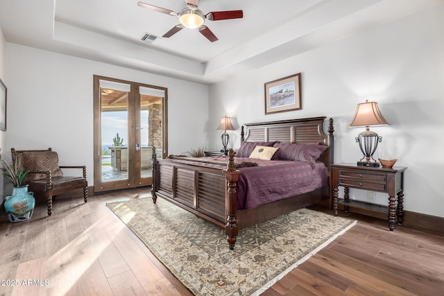 4328 N Pinnacle Ridge Cir, Mesa, AZ 85207 - bedroom featuring french doors, a raised ceiling, access to outside, hardwood / wood-style floors, and baseboards