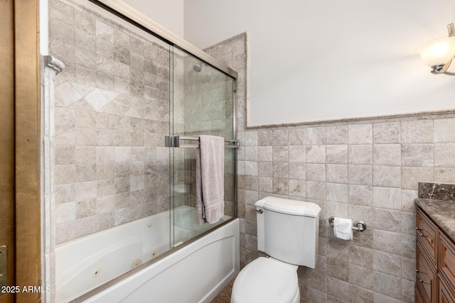 4328 N Pinnacle Ridge Cir, Mesa, AZ 85207 - bathroom with vanity, toilet, a combined bath / shower with jetted tub, tile walls, and wainscoting