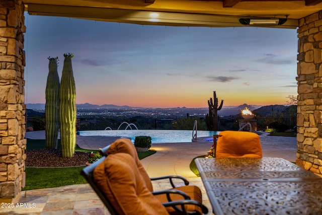 4328 N Pinnacle Ridge Cir, Mesa, AZ 85207 - patio terrace at dusk featuring a patio and outdoor dining area