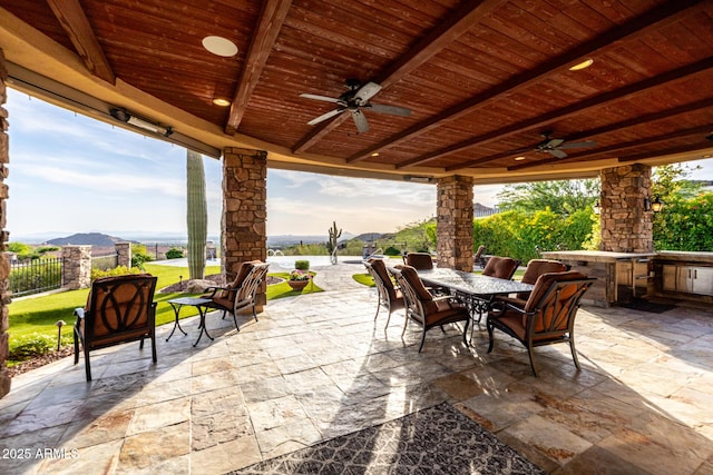 4328 N Pinnacle Ridge Cir, Mesa, AZ 85207 - view of patio featuring outdoor dining space, a ceiling fan, and exterior kitchen