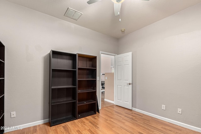 unfurnished bedroom featuring light wood-type flooring and ceiling fan