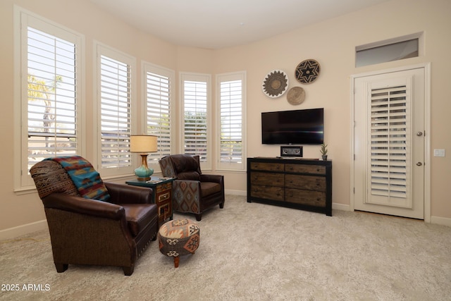 sitting room with carpet flooring and baseboards