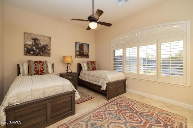 bedroom featuring visible vents, ceiling fan, baseboards, and light tile patterned flooring