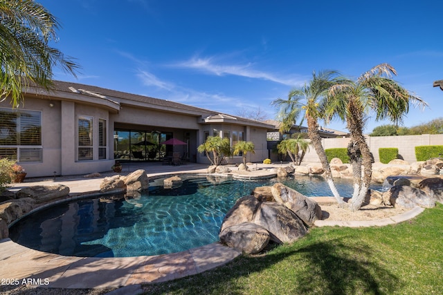 view of swimming pool with a patio area, fence, and a fenced in pool