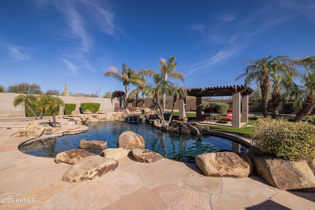 view of pool with fence, a pergola, a fenced in pool, and a patio