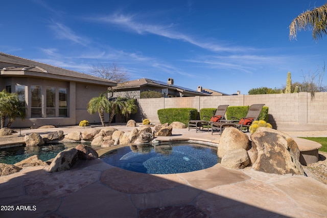 view of swimming pool with a patio area and a fenced backyard