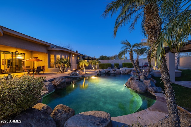 view of swimming pool featuring a patio area, a fenced backyard, and a fenced in pool