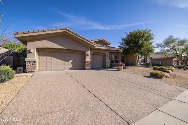 view of front facade with concrete driveway, stone siding, a tile roof, an attached garage, and stucco siding