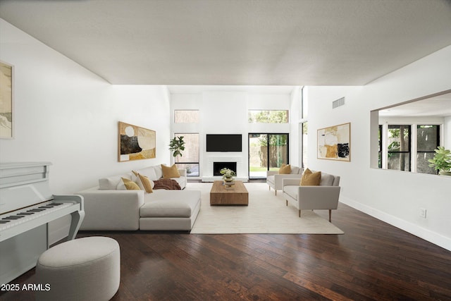 4434 E Camelback Rd Unit 132, Phoenix, AZ 85018 - living room featuring wood finished floors and a brick fireplace