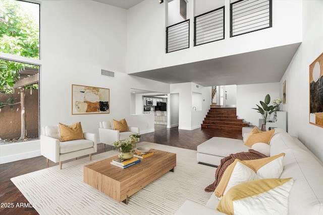 4434 E Camelback Rd Unit 132, Phoenix, AZ 85018 - living area with stairs, wood finished floors, and a high ceiling