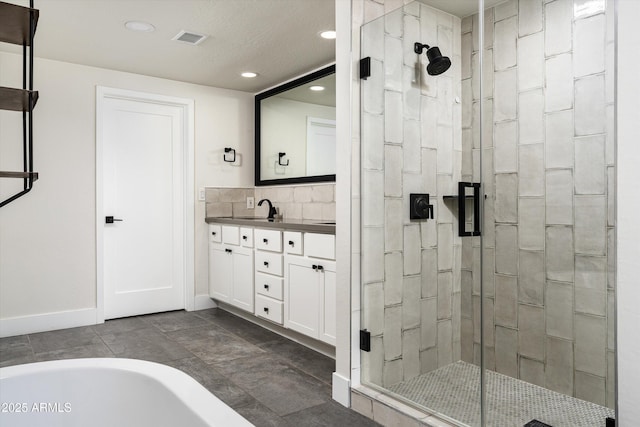 4434 E Camelback Rd Unit 132, Phoenix, AZ 85018 - full bath with a stall shower, recessed lighting, double vanity, and a bathtub