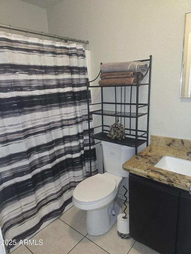 11770 W Aster Dr, El Mirage, AZ 85335 - full bathroom with tile patterned flooring, toilet, and vanity