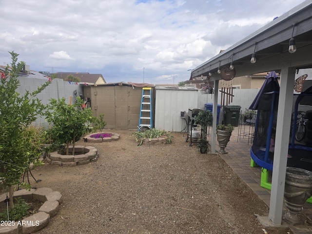 11770 W Aster Dr, El Mirage, AZ 85335 - fenced backyard featuring a shed and an outbuilding