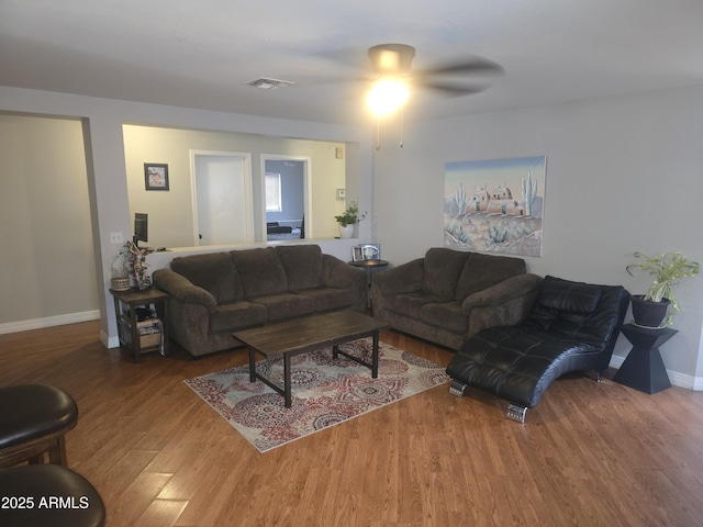 11770 W Aster Dr, El Mirage, AZ 85335 - living room with wood finished floors, a ceiling fan, and baseboards