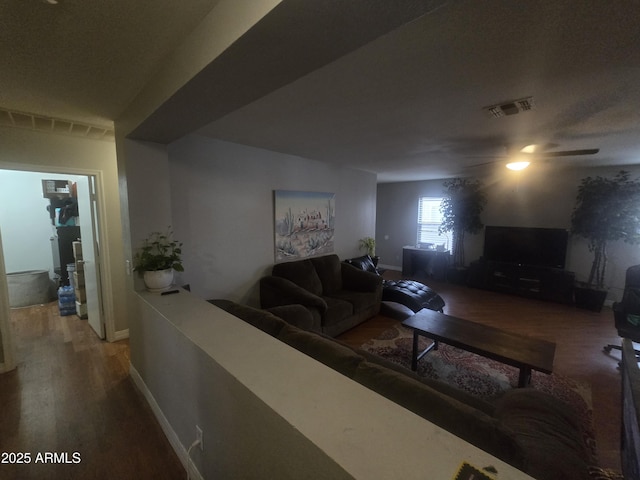 11770 W Aster Dr, El Mirage, AZ 85335 - living area featuring wood finished floors, a ceiling fan, and baseboards