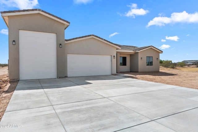 single story home featuring a garage