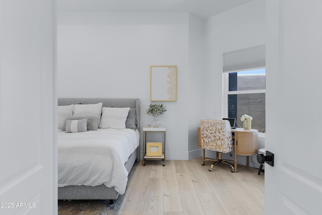 bedroom with wood finished floors