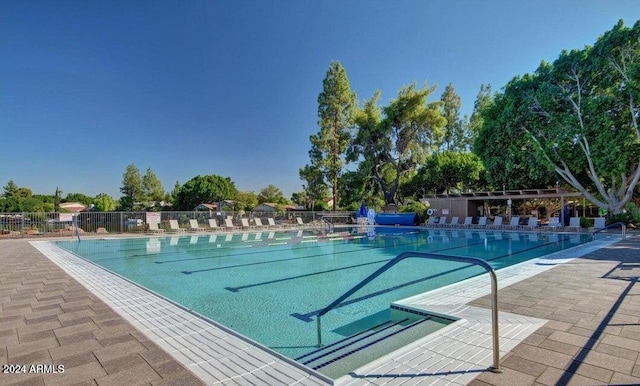 view of swimming pool featuring a patio