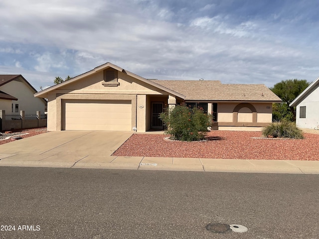 ranch-style house featuring a garage