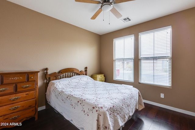 bedroom featuring dark hardwood / wood-style floors and ceiling fan