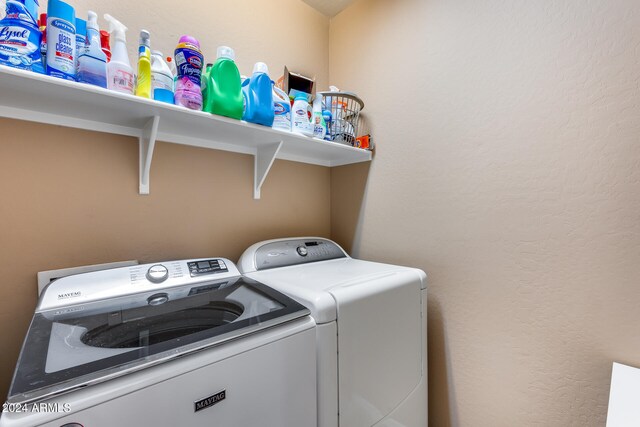 laundry area with separate washer and dryer