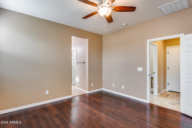 unfurnished room with hardwood / wood-style flooring and ceiling fan