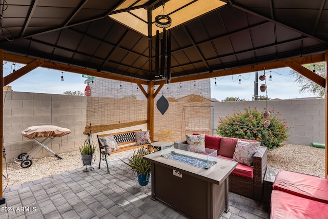 view of patio / terrace with a gazebo and an outdoor living space with a fire pit