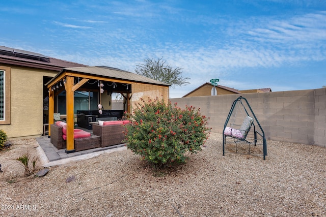 view of yard featuring a gazebo, outdoor lounge area, and a patio area